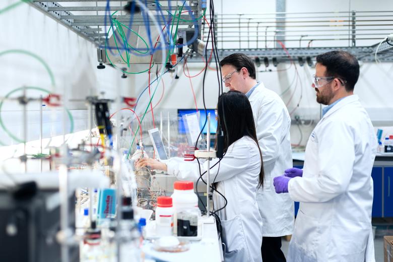 Three people in a lab