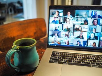 a laptop showing a google groups hangout