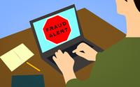 Cartoon drawing of person on laptop with Fraud Alert on the screen