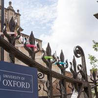 railing with a University of Oxford sign